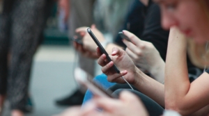 Group of teens on their phones